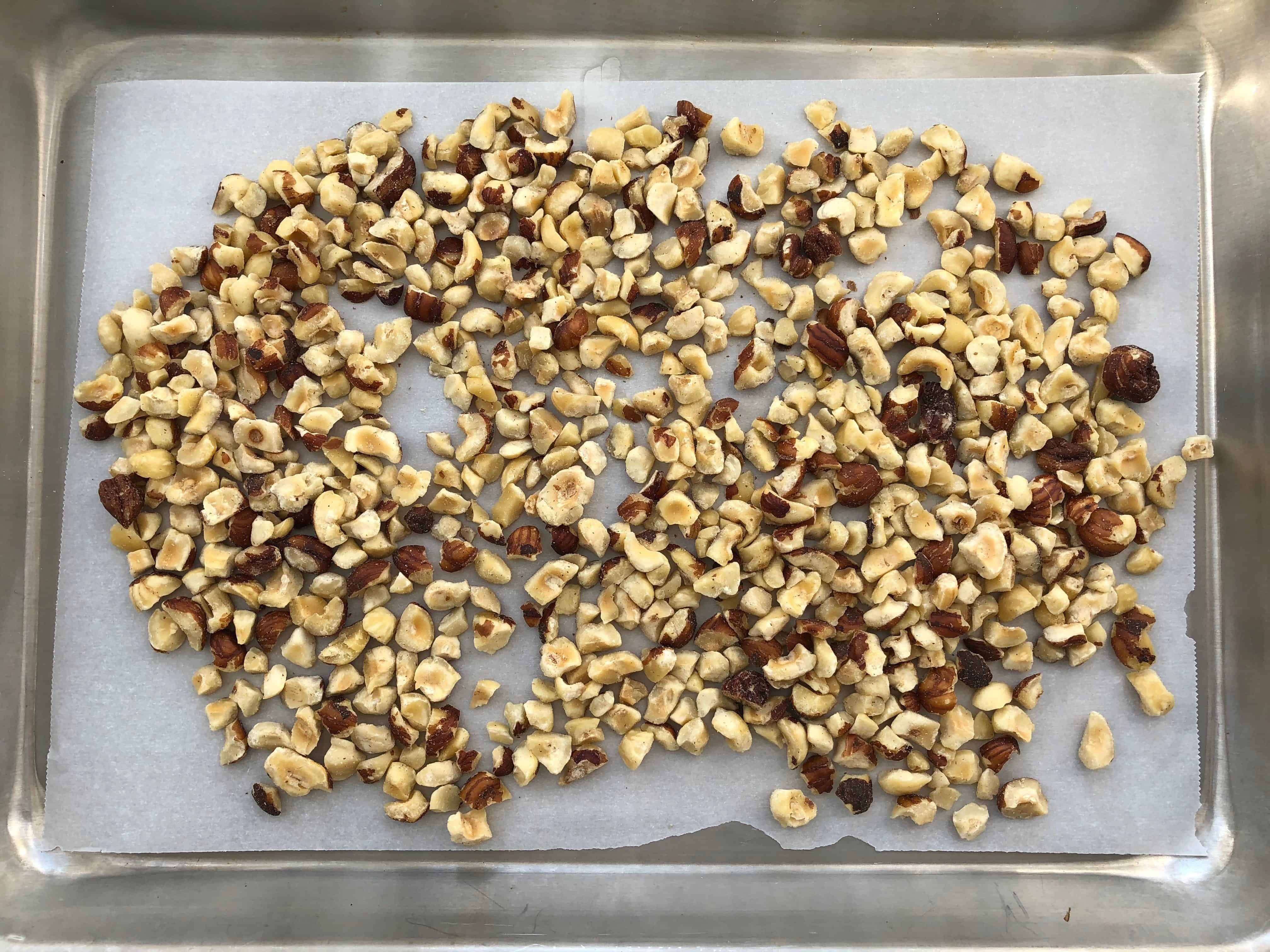 hazelnuts on a sheet pan ready to toast in oven
