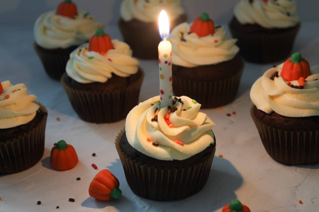 chocolate cupcakes with burning candle