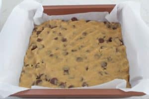 brown butter milk chocolate chips in parchment lined pan