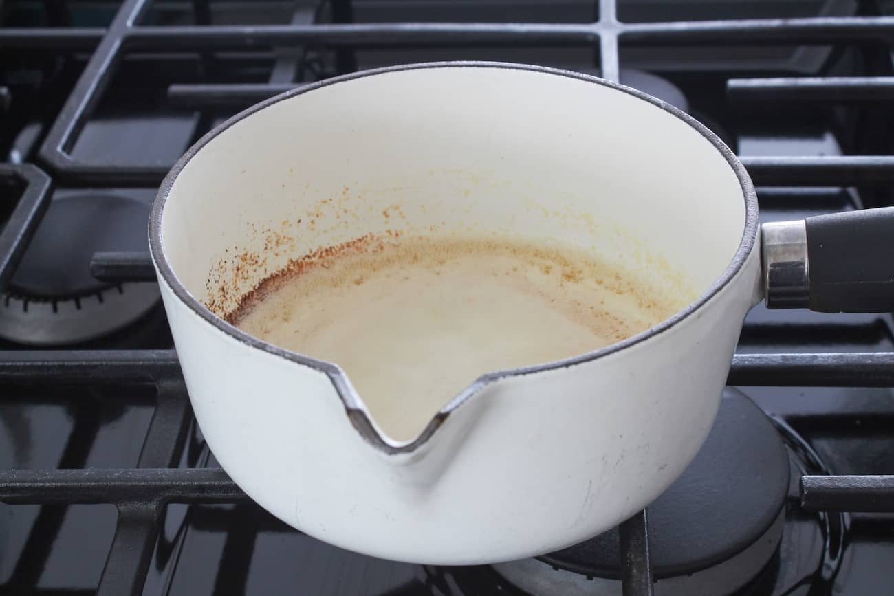 browning butter in a white saucepan